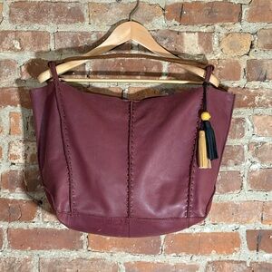 The Sak Burgundy Leather Tote Bag with Tassels